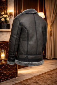 Men's Grey Shearling Leather Aviator Jacket showcasing the back view in a stylish indoor setting.